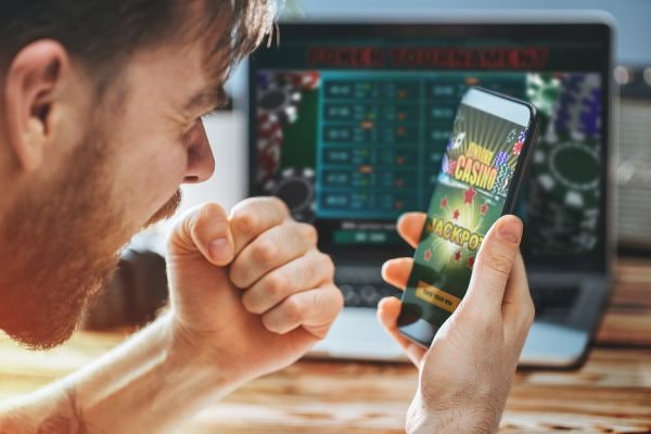 aaajili app platform hero banner showing sports and casino games in Philippines